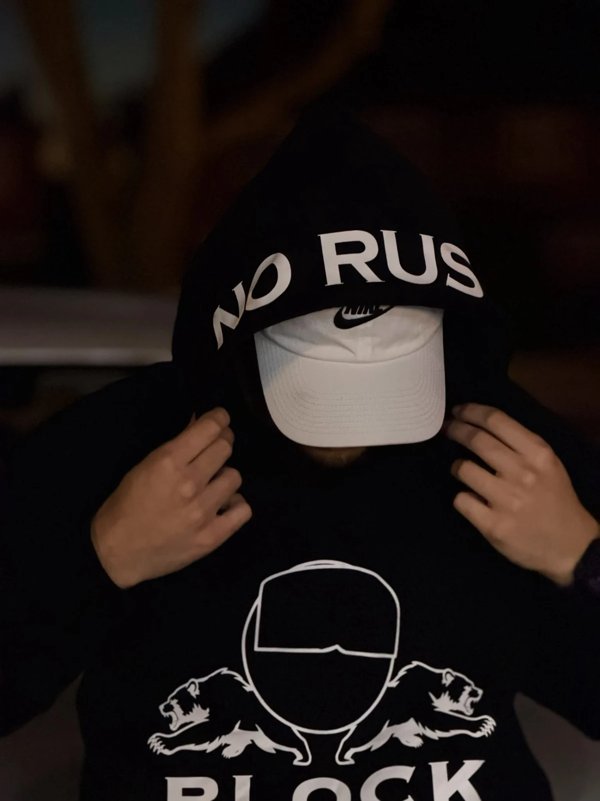 Close-up of the black NO RUSH hood and white BLOCK FIVE artwork
